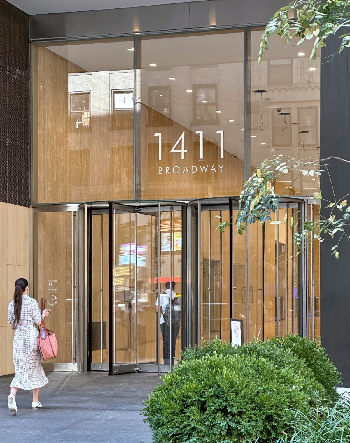 People entering through 1411 Broadway main entrance